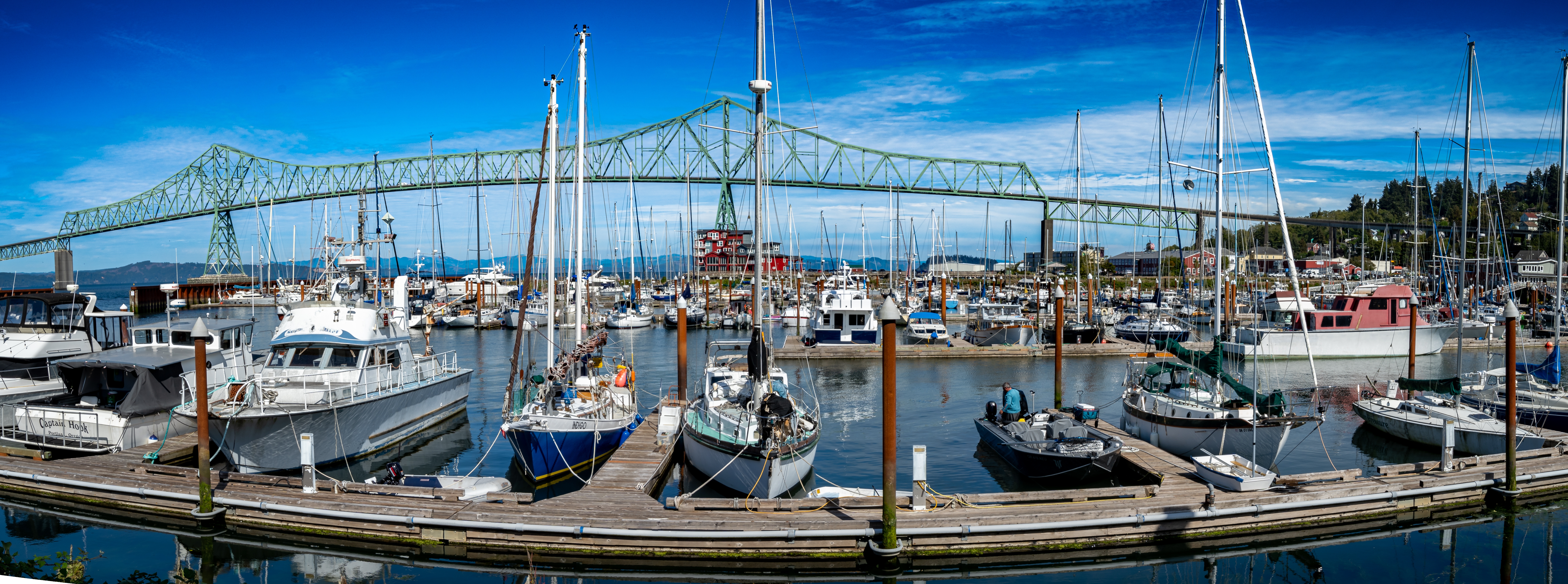 A panoramic view of Commercial fishing boats at a moorage in Astoria, Oregon.