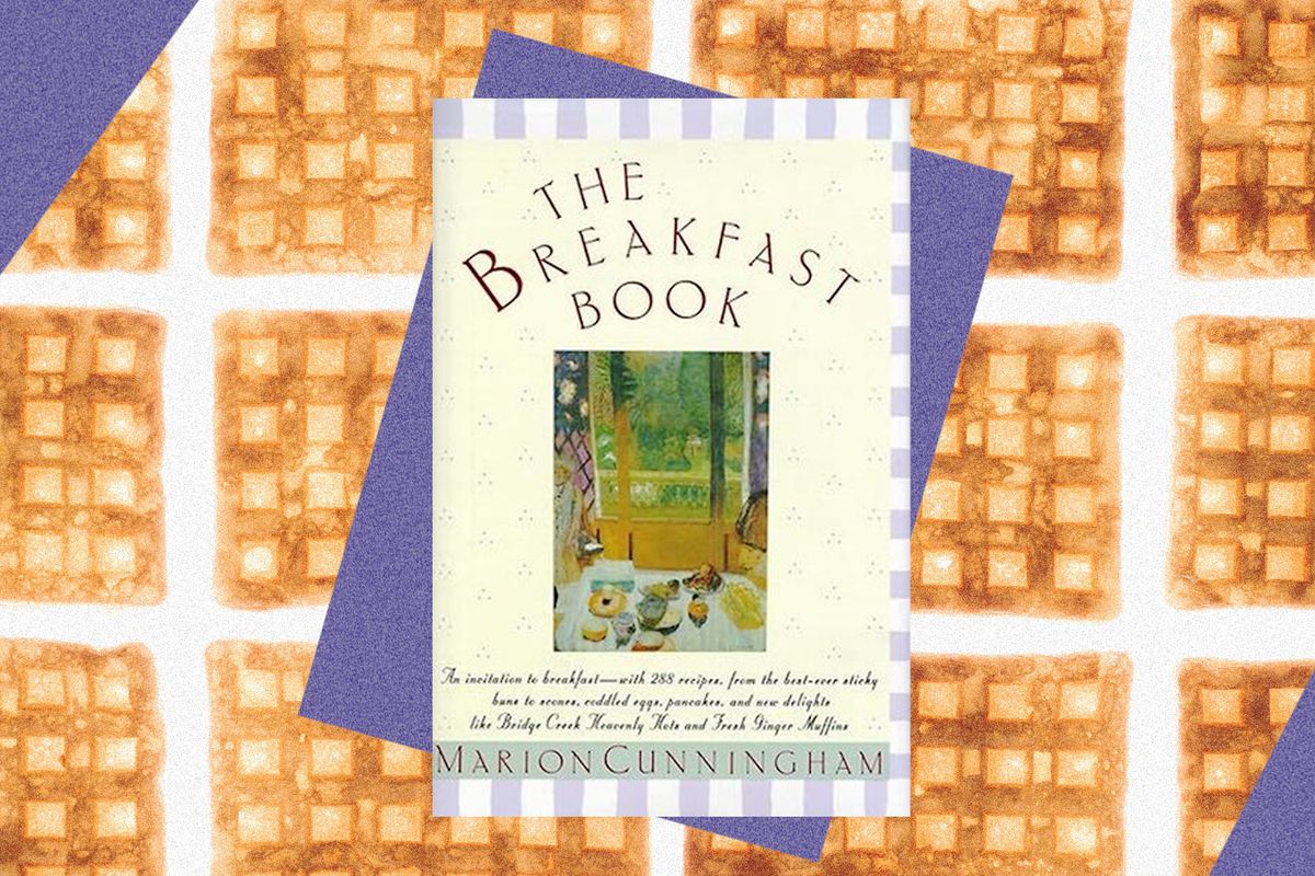 The cover of The Breakfast Book, superimposed over a backdrop of waffles. Photo illustration.